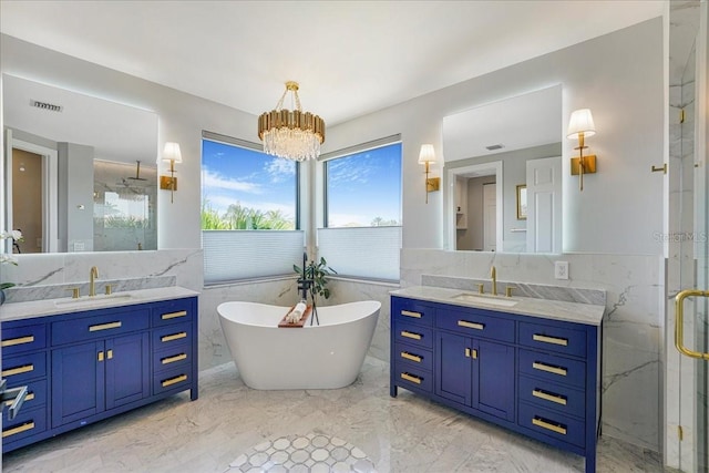 3924 SW 189th Ave, Miramar, FL 33029 - full bath featuring tile walls, a marble finish shower, marble tiled flooring, two vanities, and a soaking tub