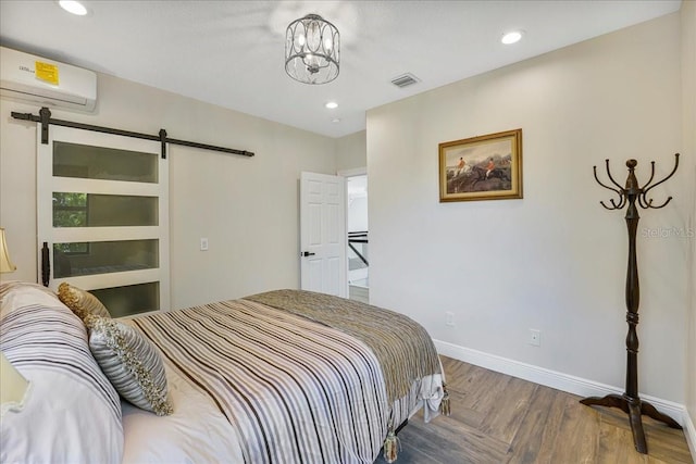 3924 SW 189th Ave, Miramar, FL 33029 - bedroom with an AC wall unit, a barn door, baseboards, recessed lighting, and a chandelier
