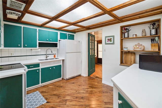3118 Walnut St, Winter Haven, FL 33881 - kitchen with freestanding refrigerator, coffered ceiling, range with electric cooktop, open shelves, and wood finished floors