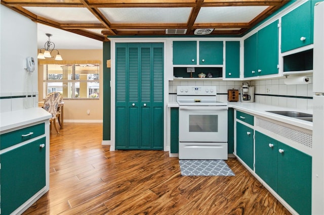 3118 Walnut St, Winter Haven, FL 33881 - kitchen with white range with electric stovetop, green cabinetry, coffered ceiling, open shelves, and dark wood-style flooring