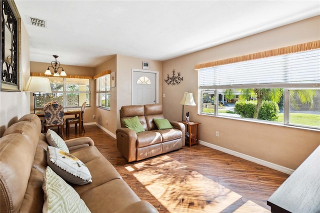 3118 Walnut St, Winter Haven, FL 33881 - living area featuring a chandelier and wood finished floors