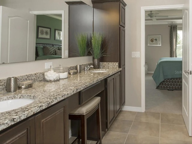 6 Fringetree Ct, Homosassa, FL 34446 - full bath with ensuite bath, double vanity, ornamental molding, baseboards, and tile patterned floors