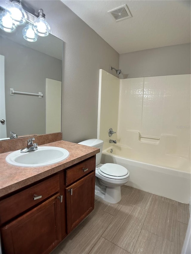 full bath with bathing tub / shower combination, toilet, and vanity