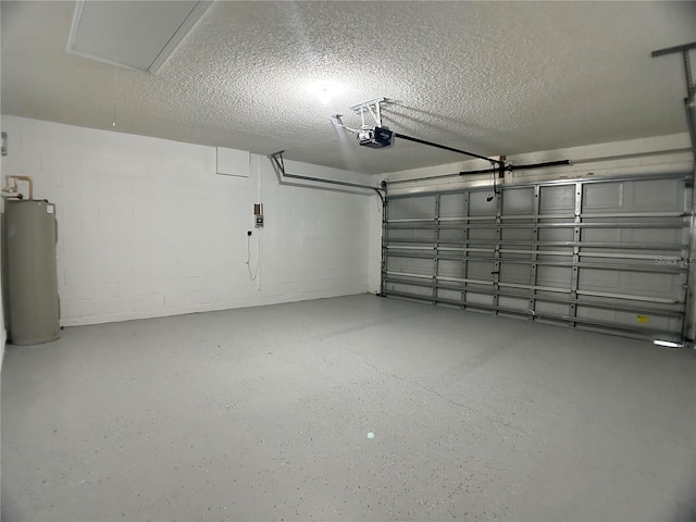 garage featuring water heater, a garage door opener, and concrete block wall