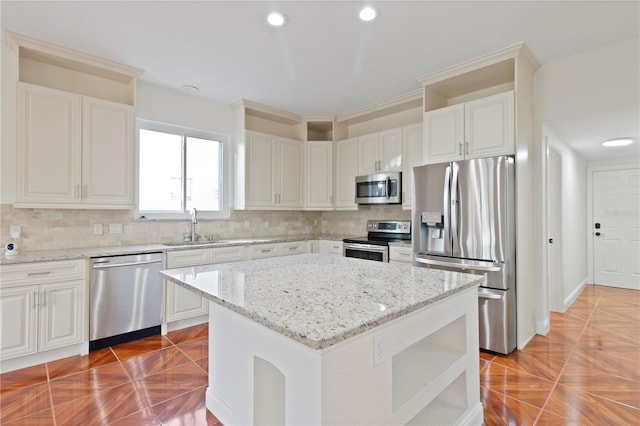 1254 Shelter Rock Rd, Orlando, FL 32835 - kitchen featuring stainless steel appliances, decorative backsplash, light stone countertops, recessed lighting, and a kitchen island