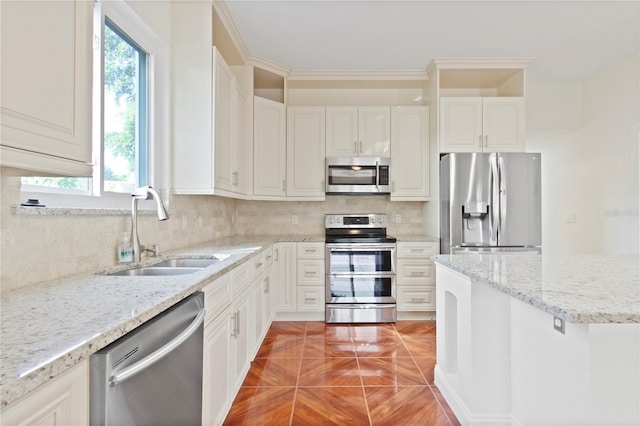 1254 Shelter Rock Rd, Orlando, FL 32835 - kitchen featuring appliances with stainless steel finishes, decorative backsplash, light stone counters, and white cabinets