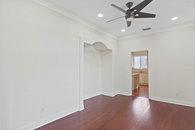 1254 Shelter Rock Rd, Orlando, FL 32835 - empty room with ceiling fan, dark wood-style flooring, ornamental molding, recessed lighting, and arched walkways