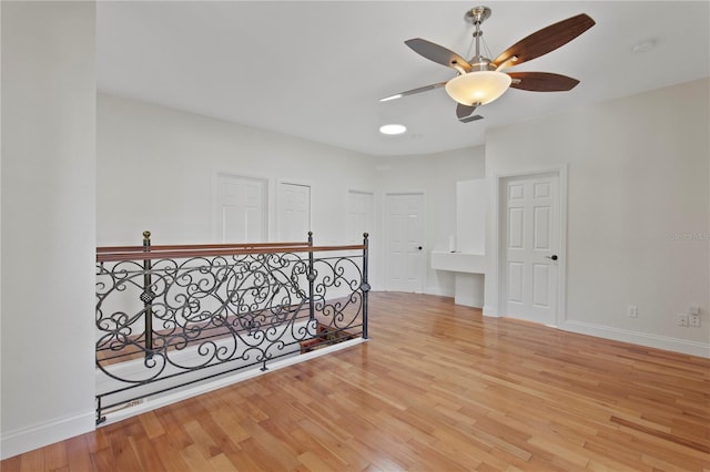 1254 Shelter Rock Rd, Orlando, FL 32835 - spare room featuring a ceiling fan, wood finished floors, and a smoke detector