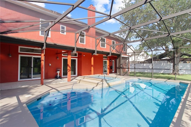 1254 Shelter Rock Rd, Orlando, FL 32835 - view of swimming pool with an in-ground hot tub, a patio, and glass enclosure