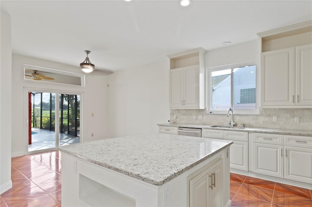 1254 Shelter Rock Rd, Orlando, FL 32835 - kitchen featuring tasteful backsplash, dishwasher, light stone counters, a ceiling fan, and recessed lighting