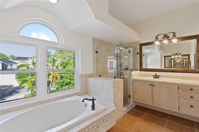 1254 Shelter Rock Rd, Orlando, FL 32835 - full bathroom with a garden tub, vanity, a shower stall, and tile patterned floors