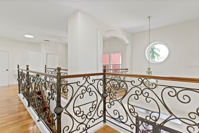 1254 Shelter Rock Rd, Orlando, FL 32835 - hall featuring wood finished floors and an upstairs landing