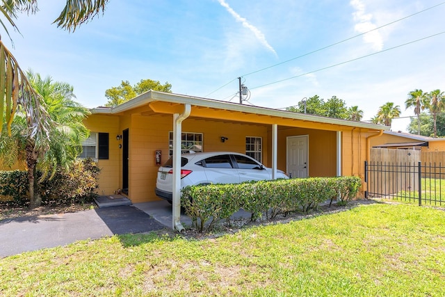 2272 Raeford Rd Unit A-3, Orlando, FL 32806 - view of side of home featuring a carport and driveway