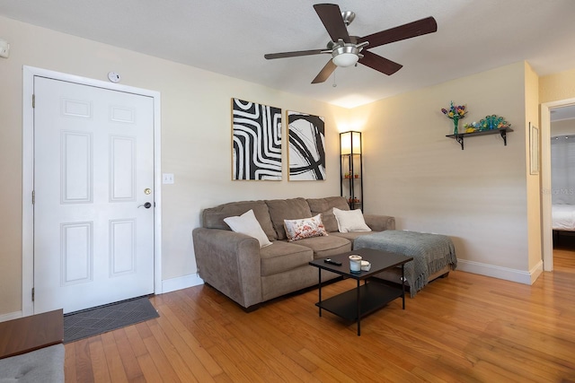 2272 Raeford Rd Unit A-3, Orlando, FL 32806 - living room with light wood-type flooring, baseboards, and ceiling fan