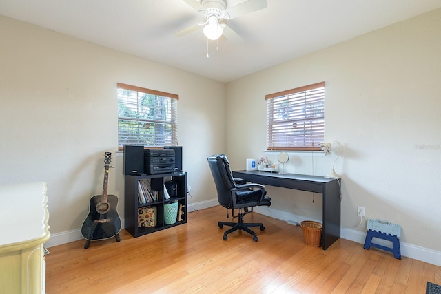2272 Raeford Rd Unit A-3, Orlando, FL 32806 - home office with a ceiling fan, wood finished floors, and baseboards