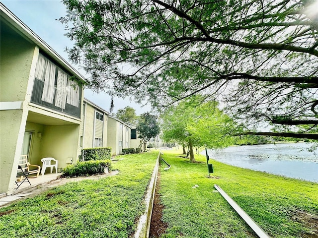 912 Lake Destiny Rd Unit F, Altamonte Springs, FL 32714 - view of grassy yard featuring a water view