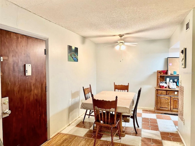 912 Lake Destiny Rd Unit F, Altamonte Springs, FL 32714 - dining area featuring a ceiling fan, a textured ceiling, and baseboards