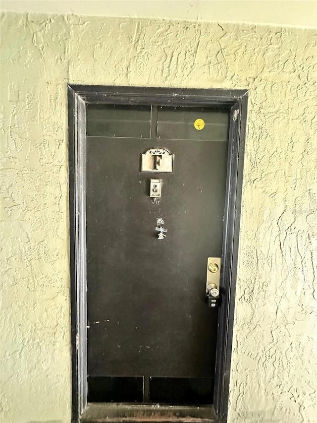 912 Lake Destiny Rd Unit F, Altamonte Springs, FL 32714 - view of exterior entry with stucco siding