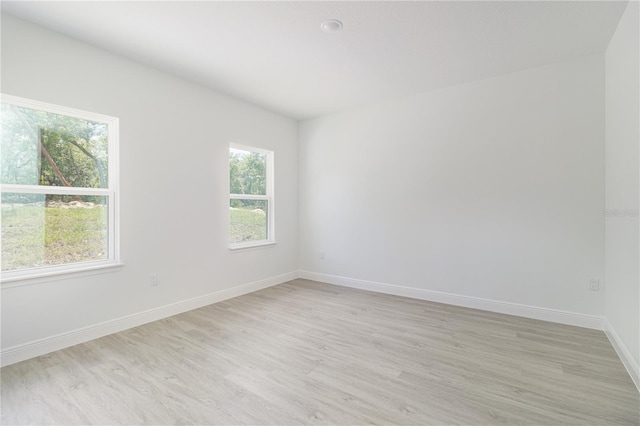 7229 N Gibralter Dr, Citrus Springs, FL 34434 - empty room featuring light wood-style flooring and baseboards