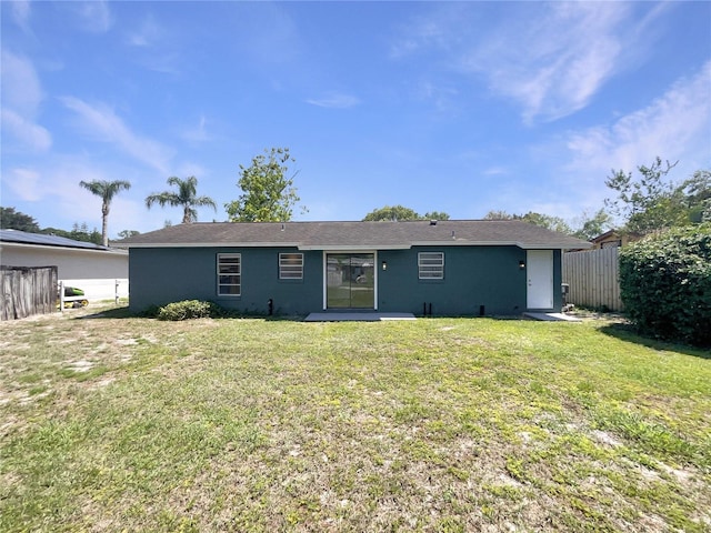 rear view of property with stucco siding