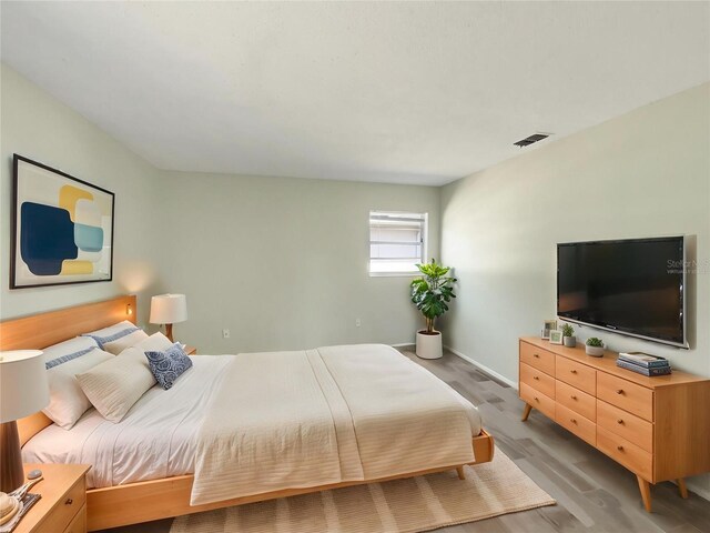 472 Little Aspen Ct, Ocoee, FL 34761 - bedroom with light wood finished floors and baseboards