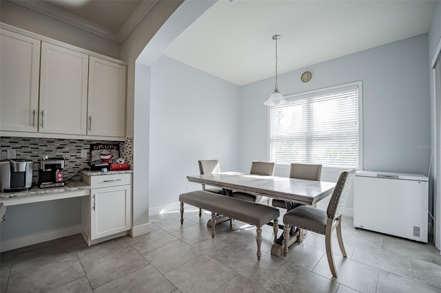 dining space featuring baseboards