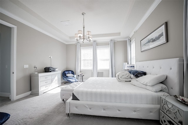 carpeted bedroom featuring a tray ceiling, a chandelier, multiple windows, and baseboards