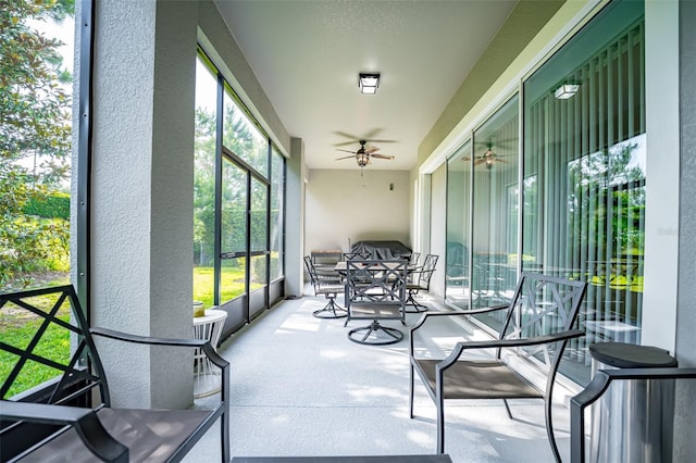 sunroom / solarium with ceiling fan