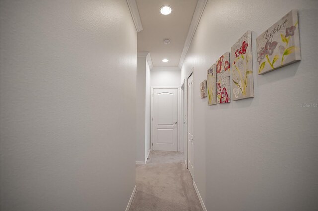 hall featuring ornamental molding, carpet, baseboards, and recessed lighting