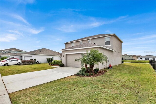 356 Quarry Rock Cir, Kissimmee, FL 34758 - view of side of home with stucco siding, driveway, a lawn, a garage, and a residential view