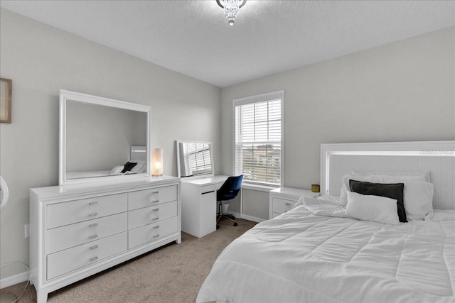 356 Quarry Rock Cir, Kissimmee, FL 34758 - bedroom with light carpet, baseboards, and a textured ceiling