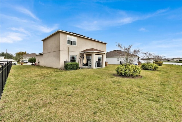 356 Quarry Rock Cir, Kissimmee, FL 34758 - back of property featuring stucco siding