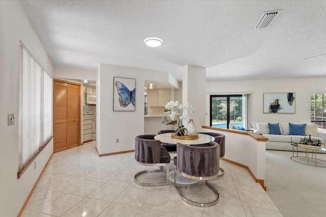 2652 Bent Hickory Cir, Longwood, FL 32779 - dining area featuring a textured ceiling and baseboards