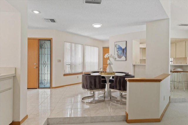 2652 Bent Hickory Cir, Longwood, FL 32779 - dining space featuring baseboards, a textured ceiling, and recessed lighting
