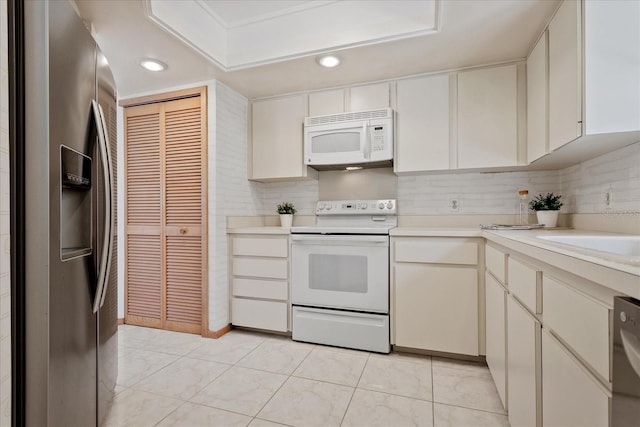 2652 Bent Hickory Cir, Longwood, FL 32779 - kitchen featuring white appliances, light countertops, recessed lighting, and decorative backsplash