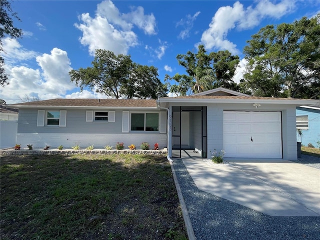 9153 86th Ave, Seminole, FL 33777 - ranch-style house featuring an attached garage and driveway