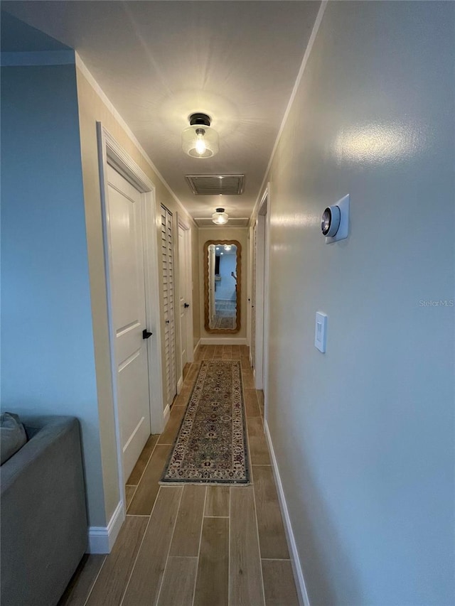 9153 86th Ave, Seminole, FL 33777 - hall with wood tiled floors and baseboards