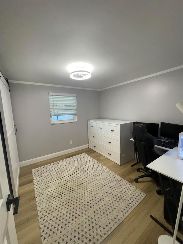 9153 86th Ave, Seminole, FL 33777 - office area featuring crown molding, light wood-style flooring, and baseboards