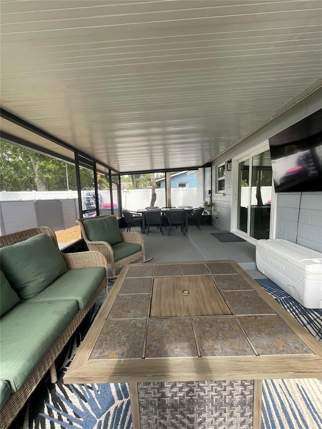 9153 86th Ave, Seminole, FL 33777 - sunroom / solarium featuring an outdoor hangout area and healthy amount of natural light