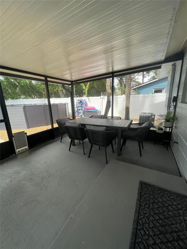 9153 86th Ave, Seminole, FL 33777 - sunroom featuring outdoor dining space and healthy amount of natural light