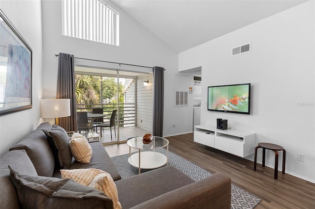 3900 Southpointe Dr Unit 127, Orlando, FL 32822 - living room featuring high vaulted ceiling, wood finished floors, and baseboards