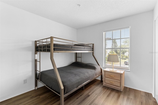 3900 Southpointe Dr Unit 127, Orlando, FL 32822 - bedroom with wood finished floors and baseboards