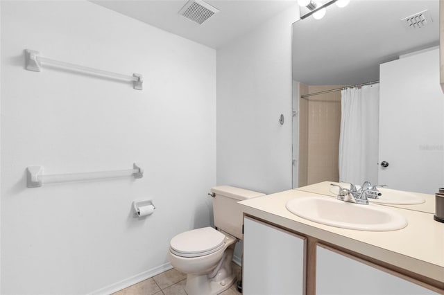 3900 Southpointe Dr Unit 127, Orlando, FL 32822 - bathroom featuring vanity, toilet, tile patterned floors, and a shower with curtain