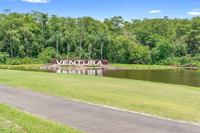 3900 Southpointe Dr Unit 127, Orlando, FL 32822 - view of community with a yard, a water view, and a view of trees