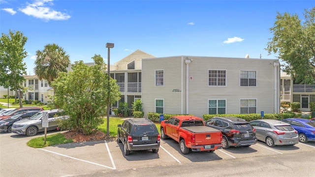 3900 Southpointe Dr Unit 127, Orlando, FL 32822 - view of property featuring uncovered parking