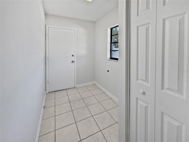 6623 Baybrooks Cir, Temple Terrace, FL 33617 - doorway to outside featuring baseboards and light tile patterned flooring