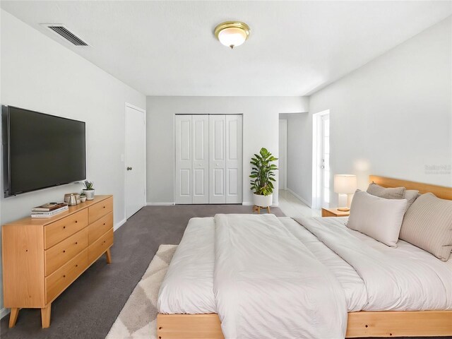 6623 Baybrooks Cir, Temple Terrace, FL 33617 - carpeted bedroom featuring a closet and baseboards