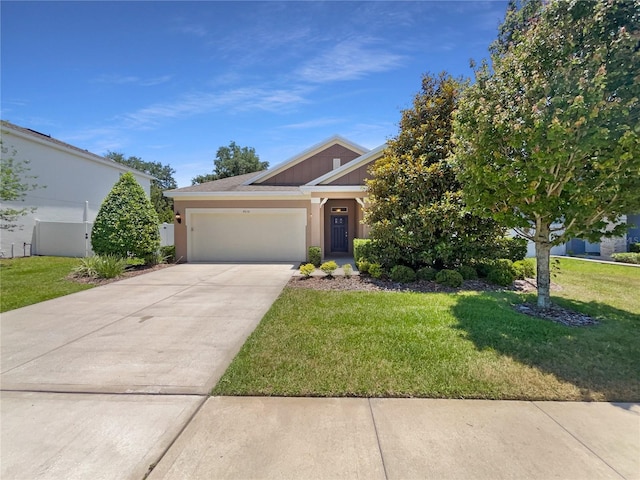 4010 Brookshire Cir, Eustis, FL 32736 - view of front facade featuring an attached garage, concrete driveway, and a front lawn