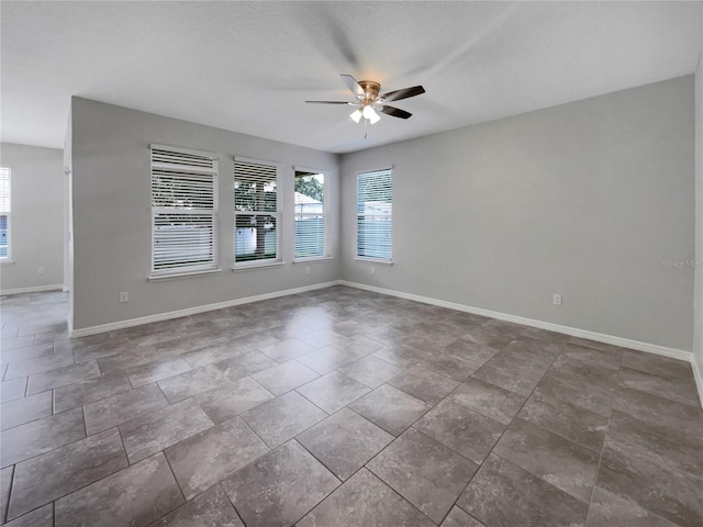 4010 Brookshire Cir, Eustis, FL 32736 - unfurnished room featuring ceiling fan, healthy amount of natural light, and baseboards