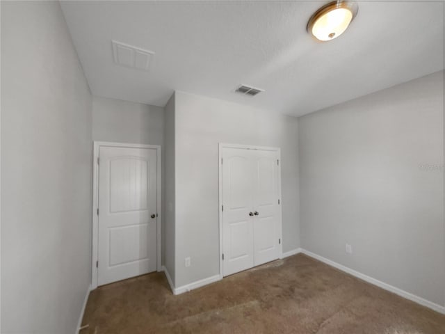 4010 Brookshire Cir, Eustis, FL 32736 - unfurnished bedroom featuring carpet floors, baseboards, and a closet